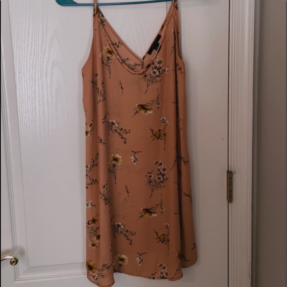 Woman’s pink flower dress